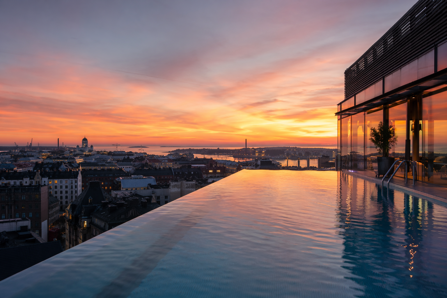 Levellanch247 rooftop infinity pool with Helsinki skyline panoramic view at sunset